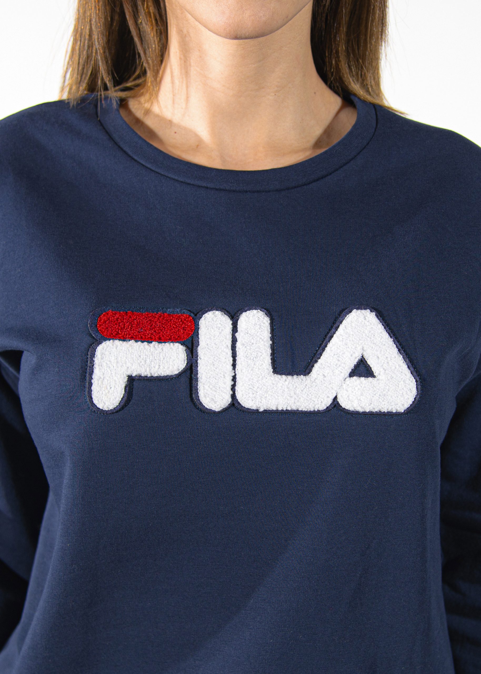 maglia della tuta femminile di colore blu con logo fila in rilievo